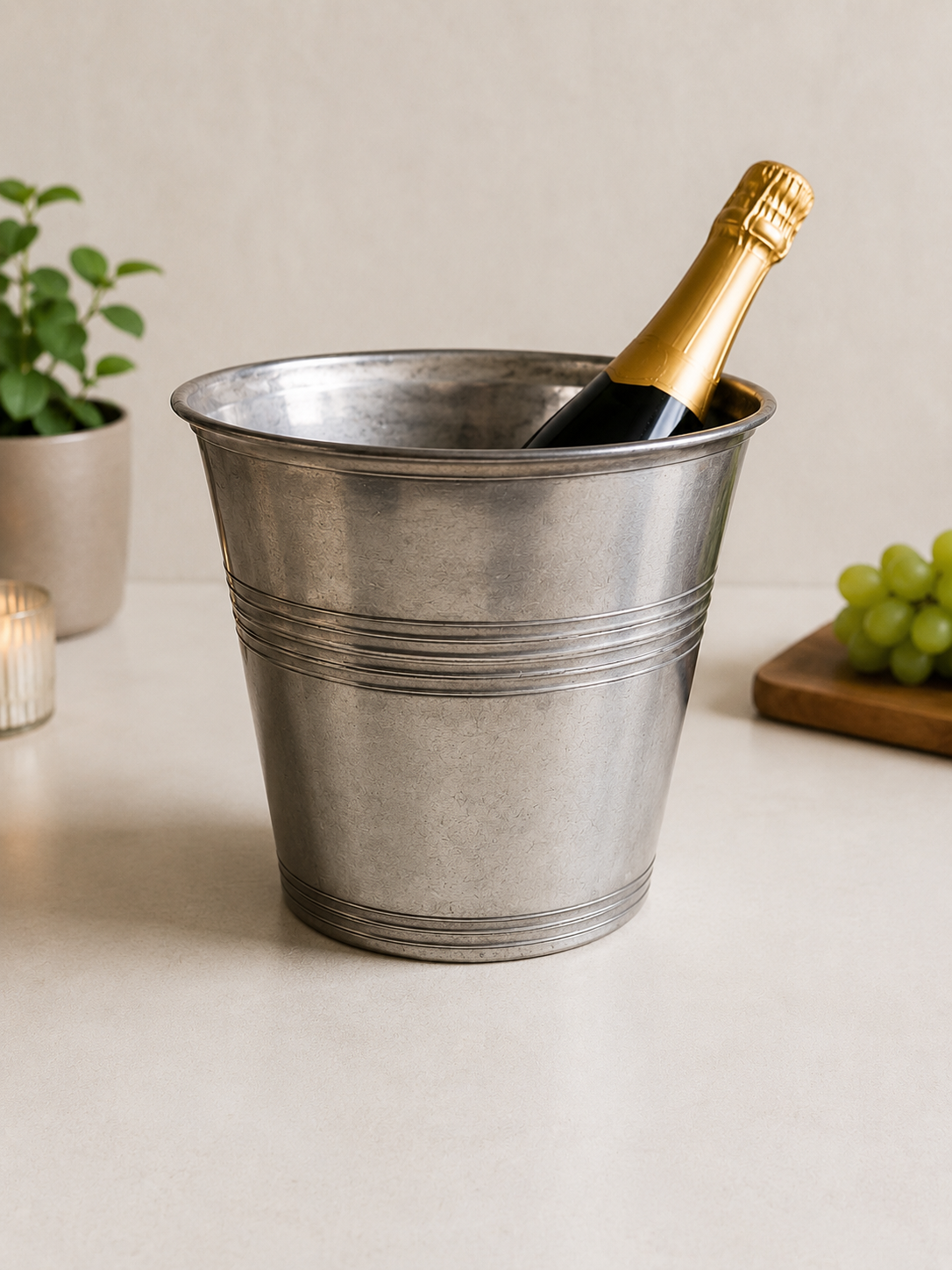 Portabottiglie / Secchiello
Champagne Vintage in
Peltro